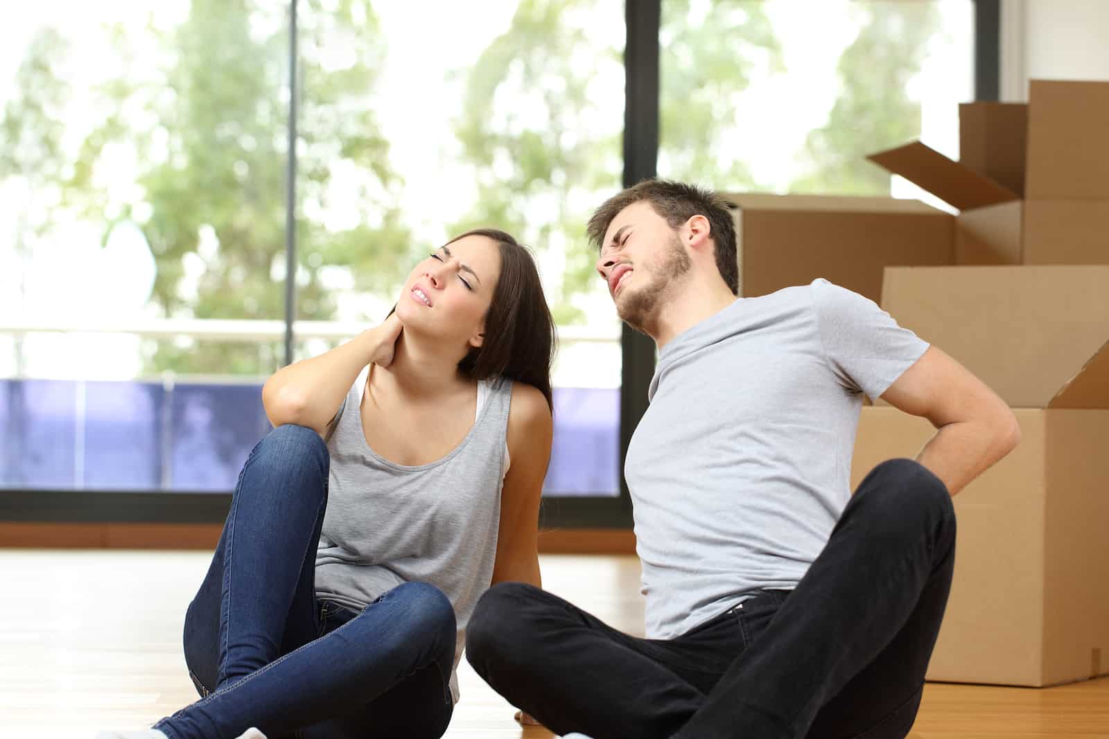 Tired Couple Moving Home Suffering